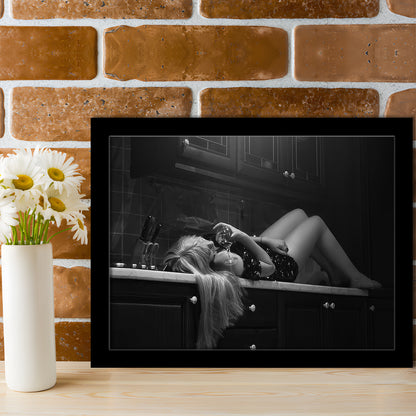 Woman Laying On Kitchen Counter Holding Wine Glass Framed Art Print Wall Decor, Drunk Woman Black and White Wall Decor