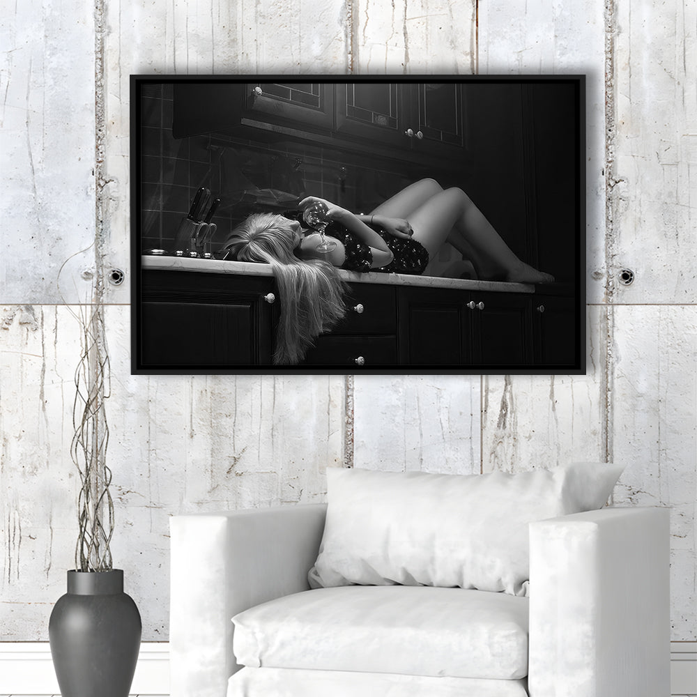 Woman Laying On Kitchen Counter Holding Wine Glass Framed Canvas Print Wall Art, Drunk Woman Black and White Wall Decor