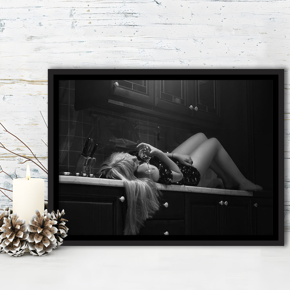 Woman Laying On Kitchen Counter Holding Wine Glass Framed Canvas Print Wall Art, Drunk Woman Black and White Wall Decor